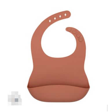 Soft silicone baby bib in terracotta for easy clean & mess-free mealtime, featuring an adjustable neck strap and large pocket.
